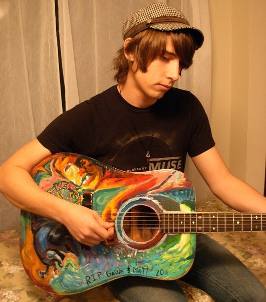 Playing a painted guitar by friends Gavin and Matt